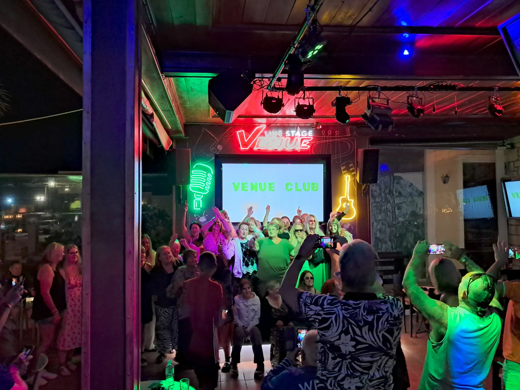 Guitarist Live Performance on Stage at Venue Bar Kalamaki